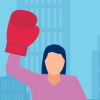 Healthcare worker holds up her solidarity fist wearing a boxing glove