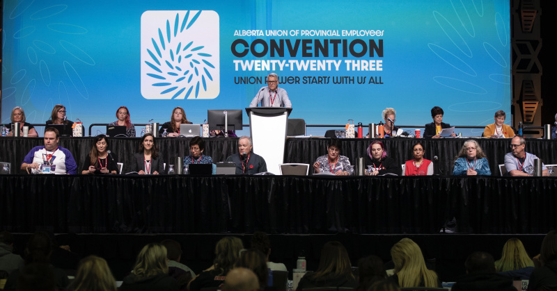 AUPE Executive and staff sitting at the front of the Convention stage