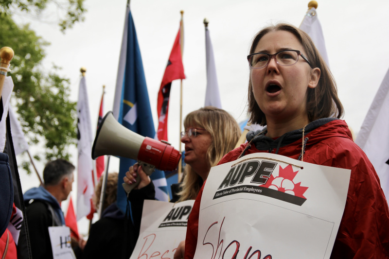 Two AUPE members take charge of a health care picket line in 2019.